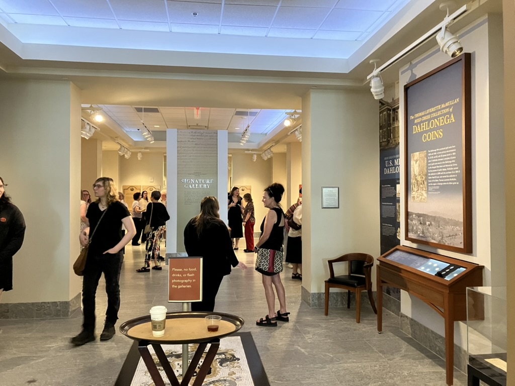 photo of people and exhibits in gallery