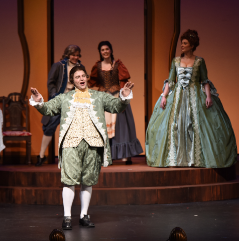photo of singers in 19th century costumes on stage