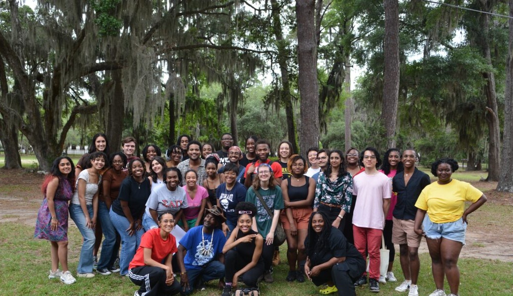 group photo under oaks and pines with Spanish moss