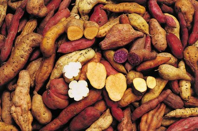 photo of many potatoes, with several cut open