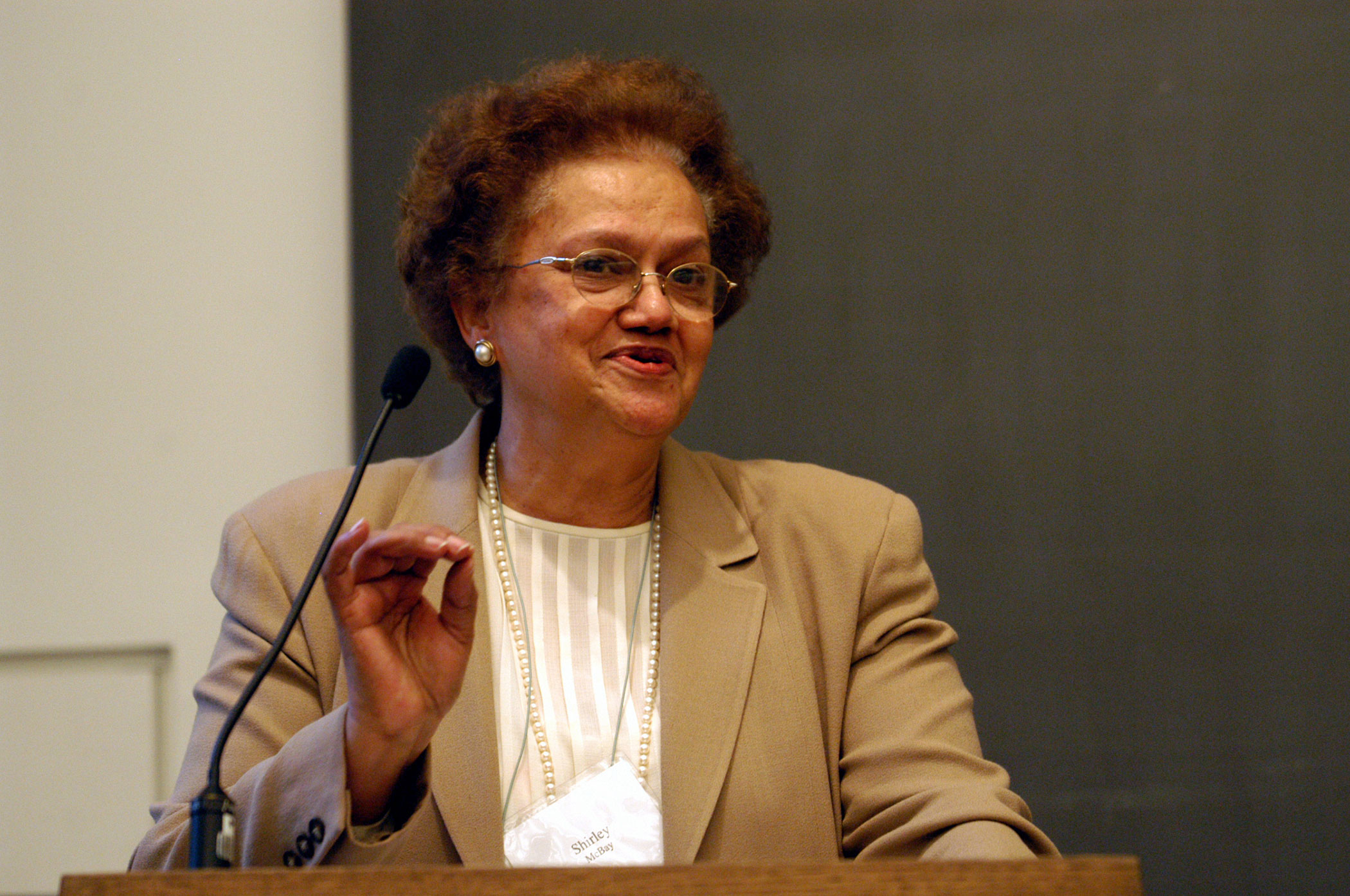 photo of Shirley Mathis at lectern with microphone
