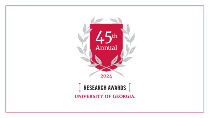 graphic with red crest, laurels, and text