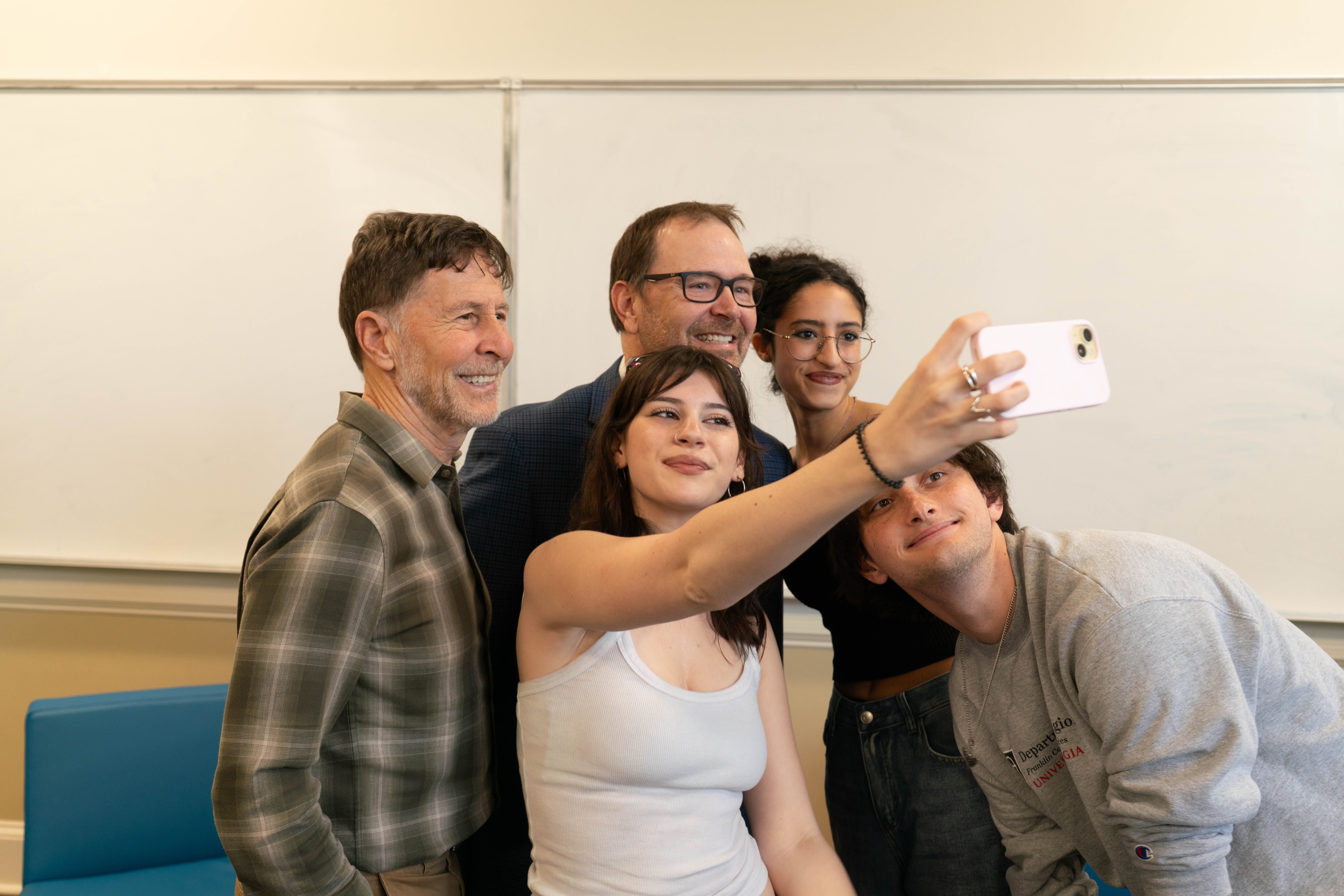 photo of five people taking a selfie