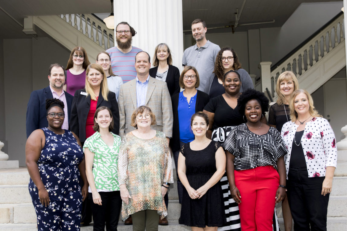 group photo on steps of the Hunter Holmes academic building