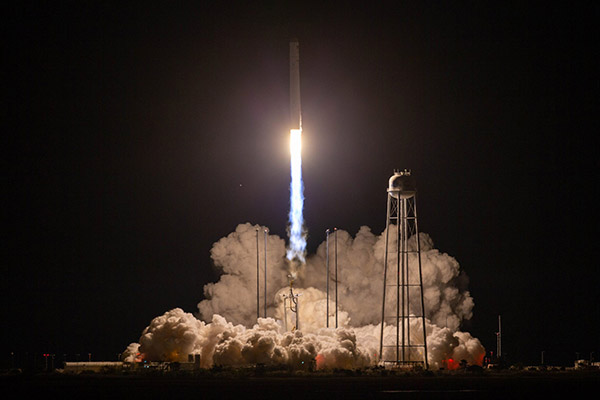 Photo of rocket launch at night