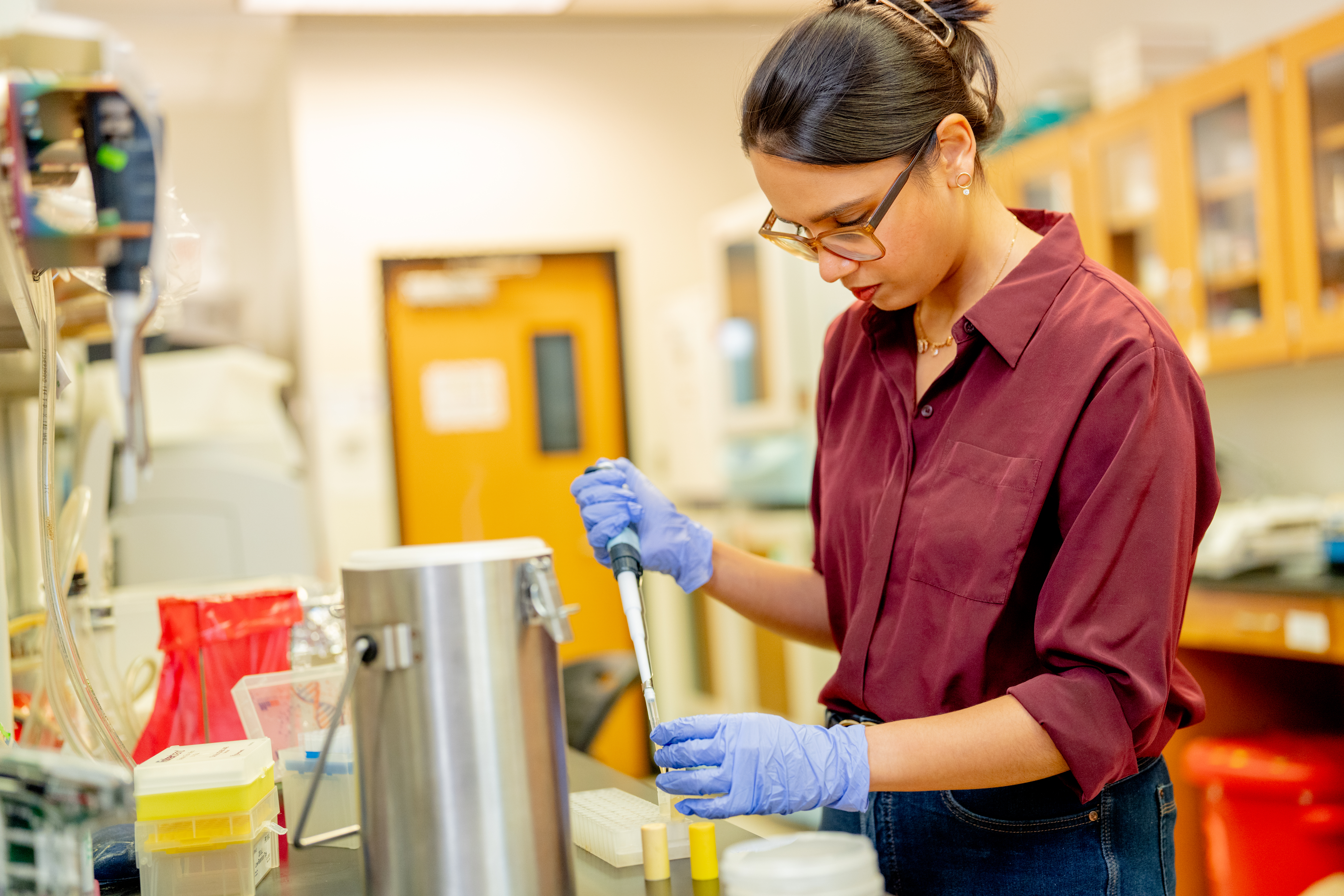 image of woman working in therapeutics lab