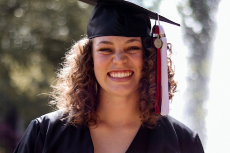 photo of woman in cap and gown