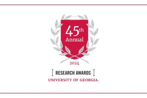 graphic with red crest, laurels, and text